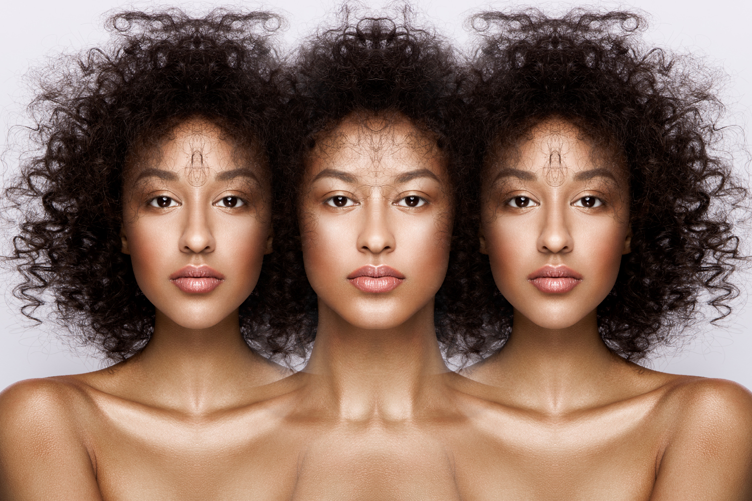 A triad of portraits containing symmetrical variations